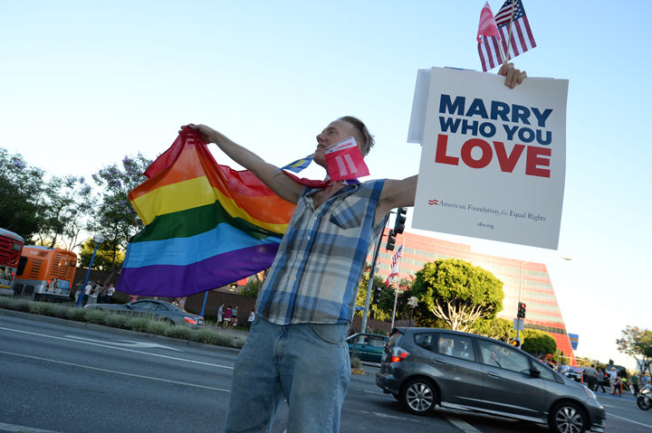 A man celebrates in West Hollywood California after the Supreme Court rulings on same-sex marriage, June 26, 2013.  