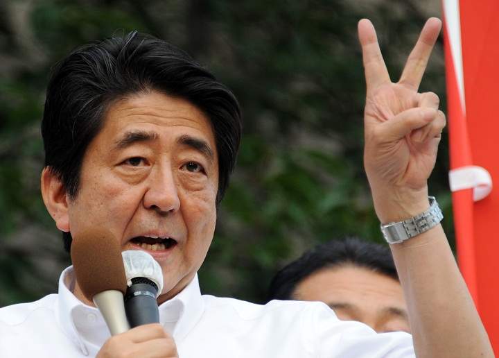 Japanese Prime Minister and ruling Liberal Democratic Party leader Shinzo Abe delivers his speech during the final day of July 21 upper house election campaign in Tokyo on July 20, 2013. 'We will get that political stability by winning the upper house election,' Japanese Prime Minister Shinzo Abe told reporters as voters nationwide will elect half of the 242-seat upper house of parliament.