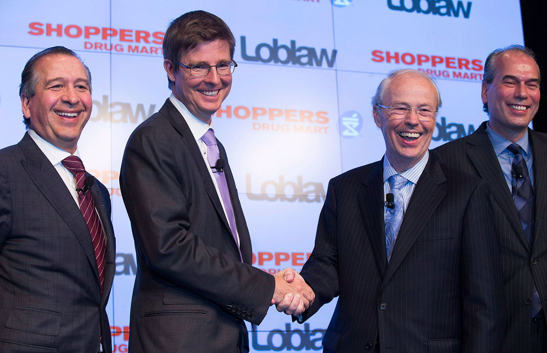 Left to right: Domenic Pilla, chief executive of Shoppers Drug Mart Corp., Galen Weston Jr., executive chairman of Loblaw Co. Ltd., Holger Kluge, chair of Shoppers and Vicente Trius president of Loblaw pose for a photo at a press conference announcing that Loblaw will acquire Shoppers for $12.4 billion in cash and stock.