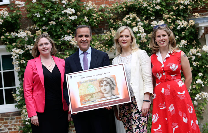Caroline Criado-Perez (far right), co-founder of the Women's Room, pose following the presentation at the Jane Austen House Museum on July 24, 2013.