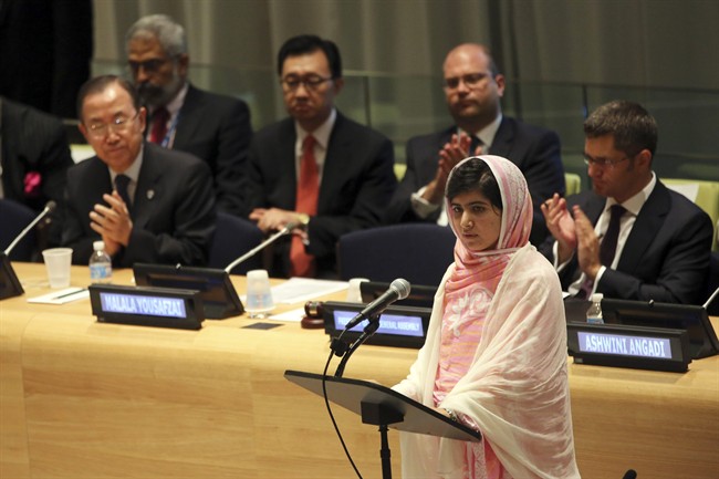 United Nations Secretary-General Ban Ki-moon, left, applauds as Malala Yousafzai, right, addresses the ‘Malala Day’ Youth Assembly, Friday, July 12, 2013.