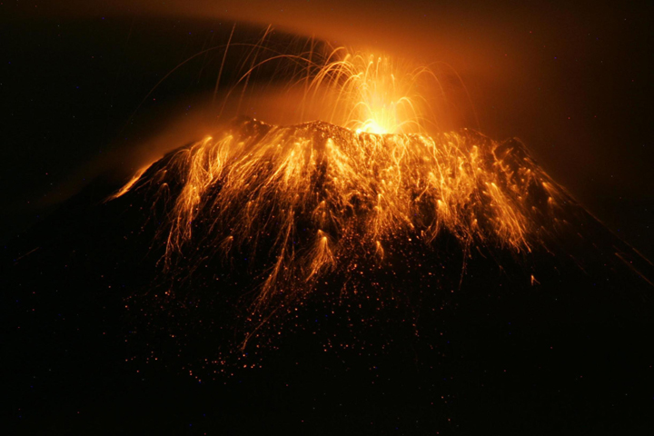 File - Lava  spurts out from the Tungurahua volcano in Pelileo, Ecuador, on May 8, 2013.