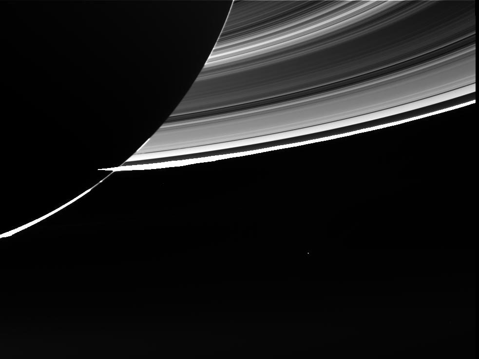 A raw image of Earth seen from Saturn. Earth is the small, bright spot seen at lower centre.