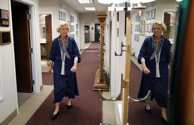 June Springer, walks between offices, where she works at Caffi Contracting Services.