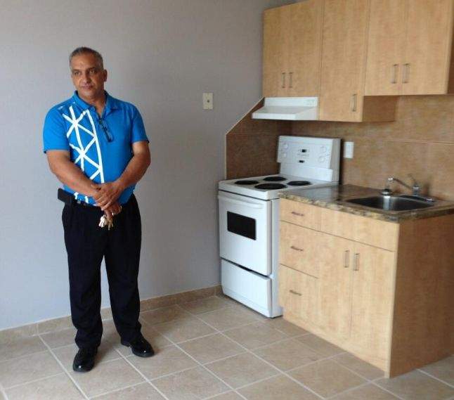 Building Manager Barry Davis stands inside renovated bachelor suite at Capital Towers in Edmonton, August 12, 2013.