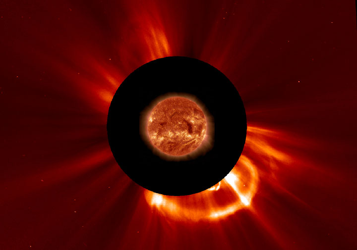 A coronal mass ejection. The black circle blocks out the light of the sun. The sun has been superimposed to show where it lies behind the black screen.