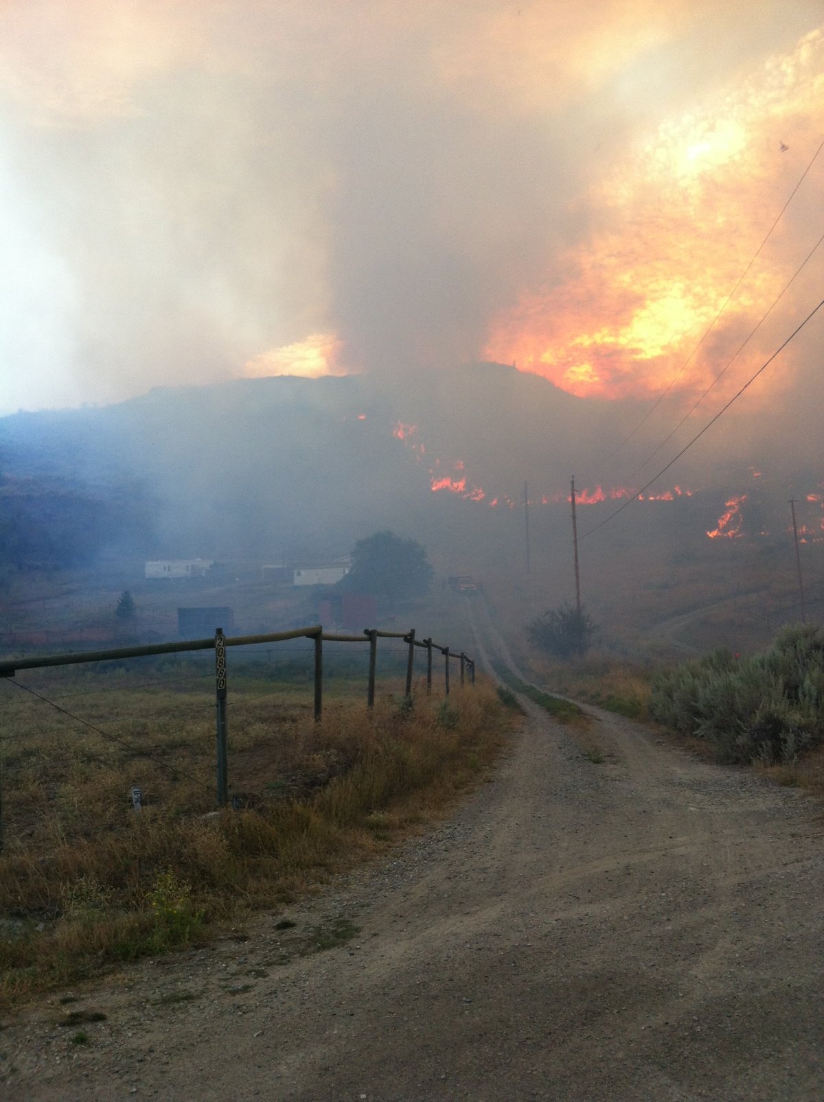 Flames crept toward homes near Osoyoos Monday night. The fire is now under control. 
