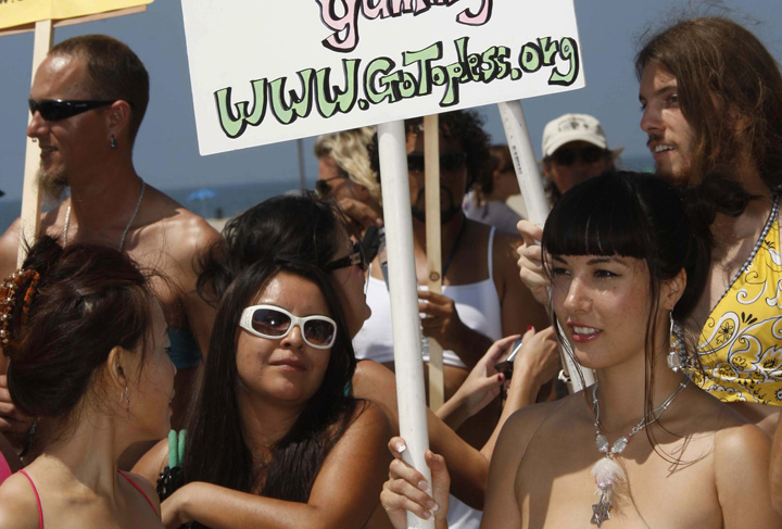 Demonstrators take part in Go Topless Day in Los Angeles, California on Aug. 23, 2013.