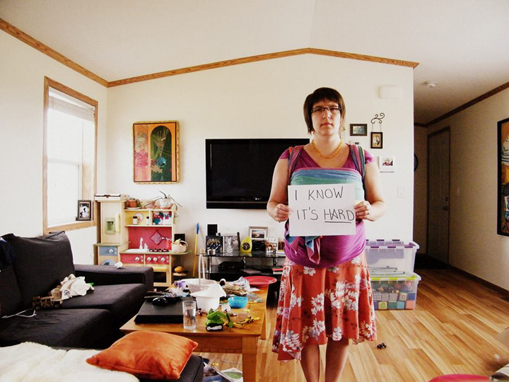 Amy Frank holds a message for other moms that's part of a video promoting awareness of postpartum mood disorders.