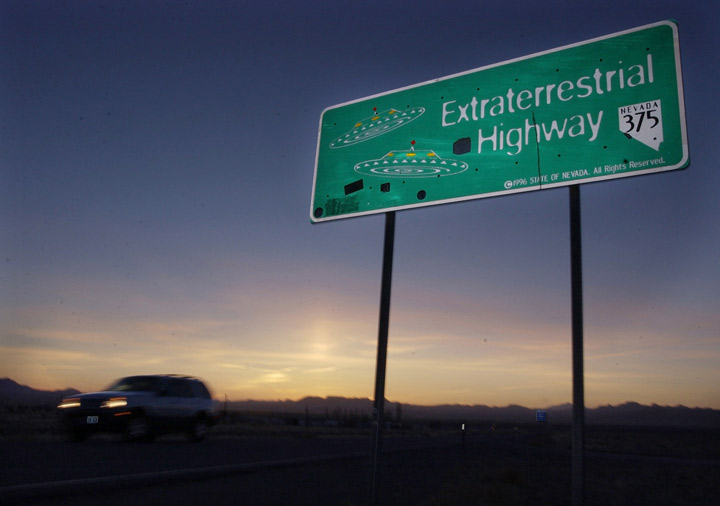File - A car moves along the Extraterrestrial Highway near Rachel, Nevada, in this Wednesday, April 10, 2002 file photo. The CIA is acknowledging the existence of Area 51 in newly declassified documents.
