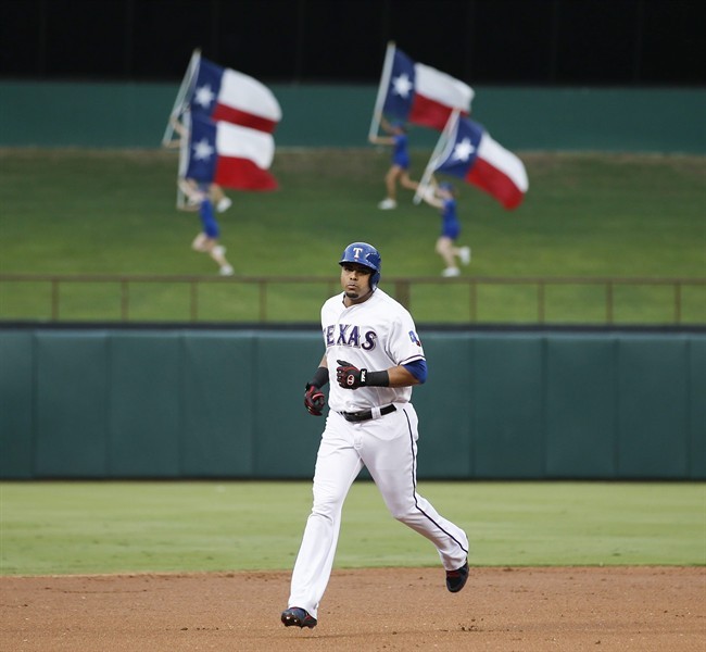 
Texas Rangers' Nelson Cruz rounds the bases after hitting a solo home-run against the Los Angeles Angels during the second inning of a baseball game, Wednesday, July 31, 2013, in Arlington, Texas.
