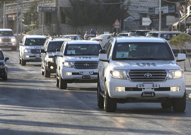The convoy of U.N. experts cross into Lebanon at the Lebanese border crossing point of Masnaa, eastern Bekaa valley, Lebanon, Saturday, Aug. 31, 2013. 
