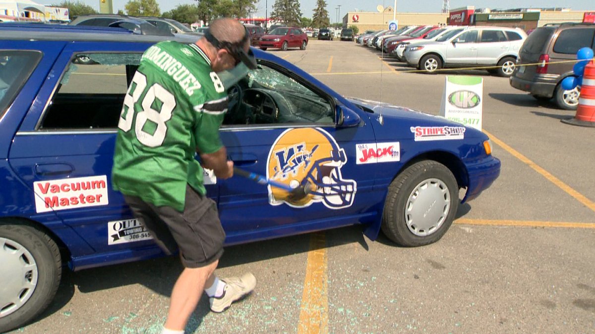 On Wednesday dozens of fans turned out to destroy a vehicle with the Winnipeg Blue Bombers logo on it. 