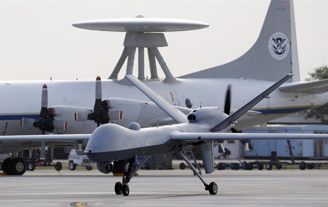 In this Nov. 8, 2011 file photo, a Predator B unmanned aircraft taxis at the Naval Air Station in Corpus Christi, Texas. - Pakistani officials say a suspected U.S.
drone strike on an Islamic seminary in northwest Pakistan has killed
six people.
(AP Photo/Eric Gay, File).