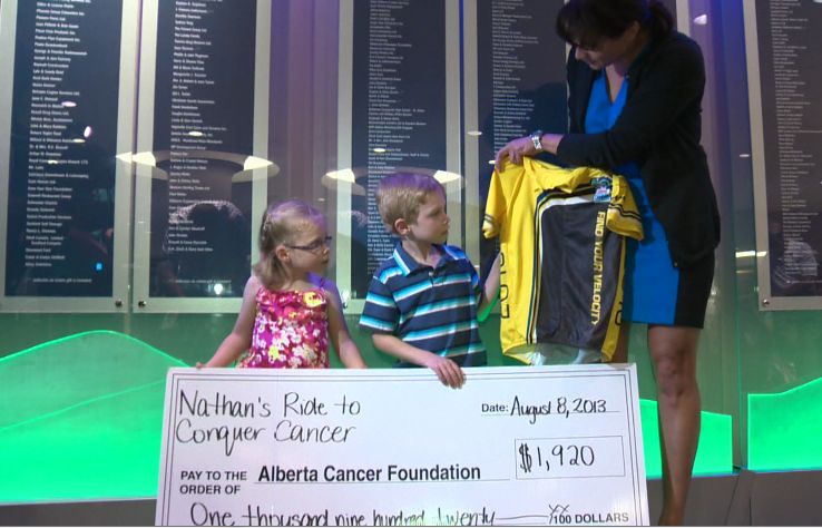 Nathan gets a pint-sized replica of the jersey normally reserved for the Ride to Conquer Cancer participants