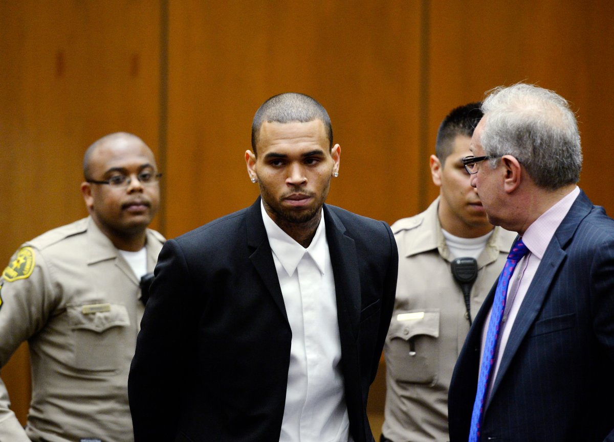 LOS ANGELES, CA - AUGUST 16: R&B singer Chris Brown appears in court with his attorney Mark Geragos for a probation hearing on August, 16 2013 in Los Angeles, California. Brown's probation has been reinstated and he must perform 1,000 hours of community service. Brown was first placed on probation after the 2009 domestic violence case in which he pleaded guilty to assaulting his then-girlfriend singer Rihanna. 