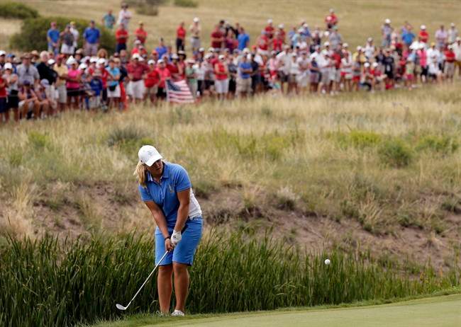 Europe's Caroline Hedwall, from Sweden, hits to the 16th green during her singles match against United States' Michelle Wie at the Solheim Cup golf tournament on Sunday, Aug. 18, 2013, in Parker, Colo. 