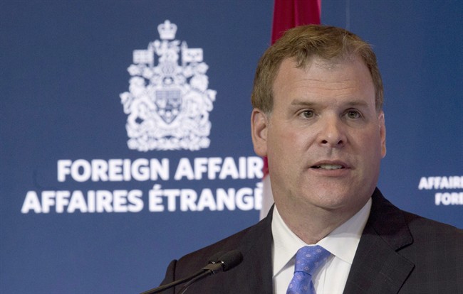 Foreign Affairs Minister John Baird speaks during a news conference in Ottawa on July 25, 2013.