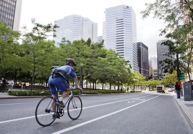 A cyclist rolls down a bicycle lane in downtown Montreal.