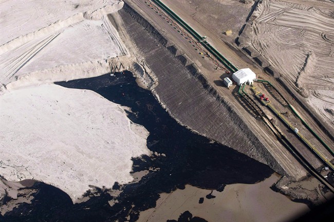 An oil sands facility is seen from a helicopter near Fort McMurray, Alta., Tuesday, July 10, 2012. A survey of thousands of environmental problems in Alberta's oilsands attacks the province's claims to having strict control over the industry's environmental impact. THE CANADIAN PRESS/Jeff McIntosh.