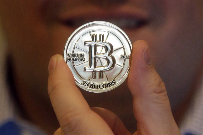 In this April 3, 2013 photo, a 25 Bitcoin token is pictured in Sandy, Utah. 