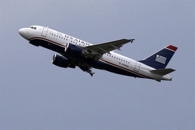 A US Airways jet takes off from Pittsburgh International Airport on July 23, 2013 in Imperial, Pa.