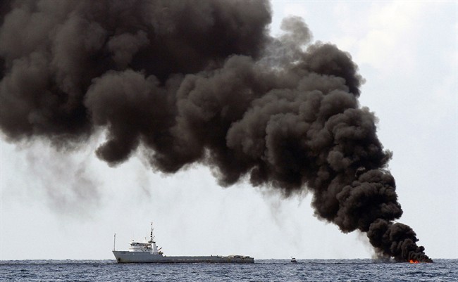 Smoke rises from a controlled burn of from the Deepwater Horizon oil well leak on the Gulf of Mexico near the coast of Louisiana in a July 16, 2010 photo.