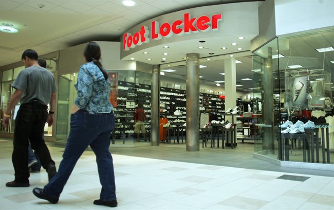 Shoppers pass by the Foot Locker store in an undated photo.