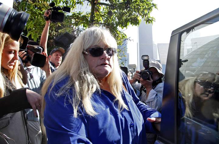 Debbie Rowe leaves a Los Angeles courthouse after testifying in a lawsuit against AEG.