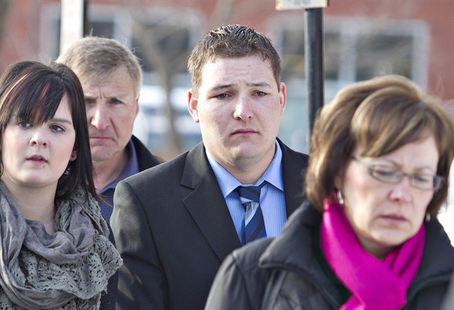 Brenden Holubowich makes his way to the courthouse for sentencing in the deaths of four high school football players, in Grande Prairie Alberta, on Tuesday February 26, 2013.