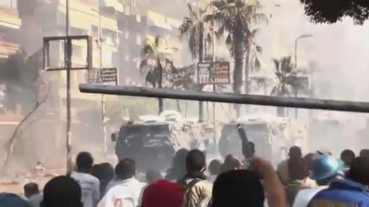 Amateur video of protesters in Egypt pelting stones at armoured vehicles, prior to being shot at.