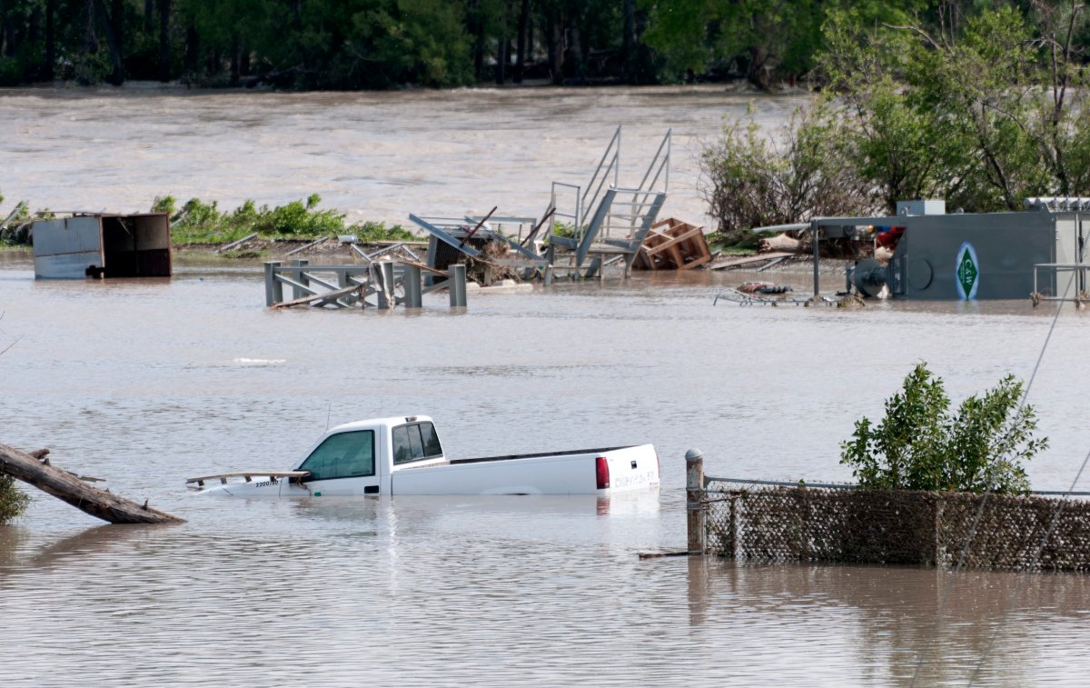 Flood water from the swollen Bow River inundates a construction facility in south Calgary, Alberta on June 23, 2013.    