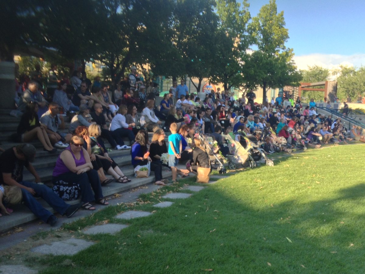 More than 100 people gathered for a candlelight vigil in memory of Lisa Gibson and her two children, 2-year-old Anna and three-month-old Nicholas, on Thursday at The Forks.