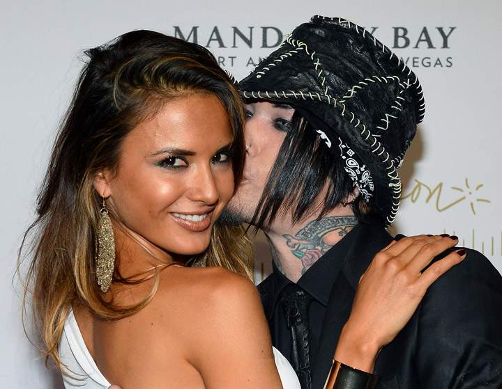 Guns N' Roses guitarist Daren Jay "DJ" Ashba with Nathalia Henao, pictured in June 2013.