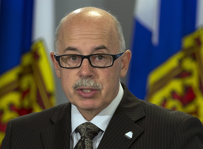 Nova Scotia Attorney General Ross Landry fields questions at a news conference in Halifax on Monday, Aug. 12, 2013.