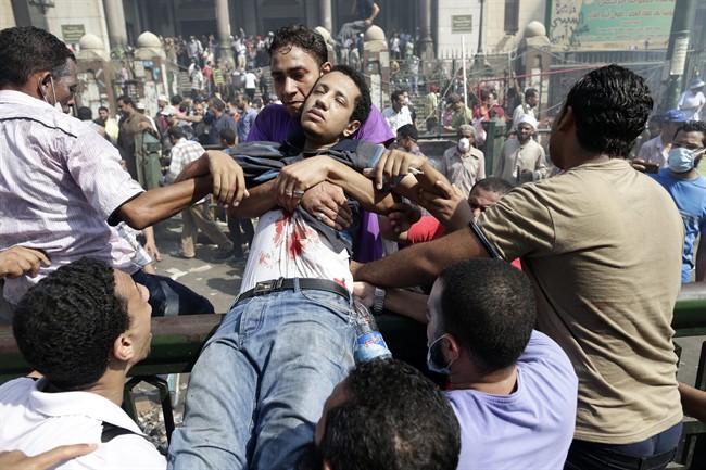 Army soldiers stand guard in front of the Ibrahim Mosque in Alexandria on August 18, 2013. Supporters of ousted Islamist president Mohamed Morsi cancelled some Cairo marches for ‘security reasons’, as the military chief vowed to face down violent protests following Egypt’s bloodiest week in recent memory.