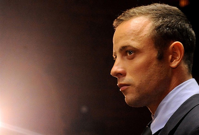 In this Friday, Feb. 22, 2013 file photo Olympic athlete Oscar Pistorius stands in the dock during his bail hearing at the magistrates court in Pretoria, South Africa. Pistorius is scheduled to re-appear in a South African court on Monday Aug.19, 2013. 