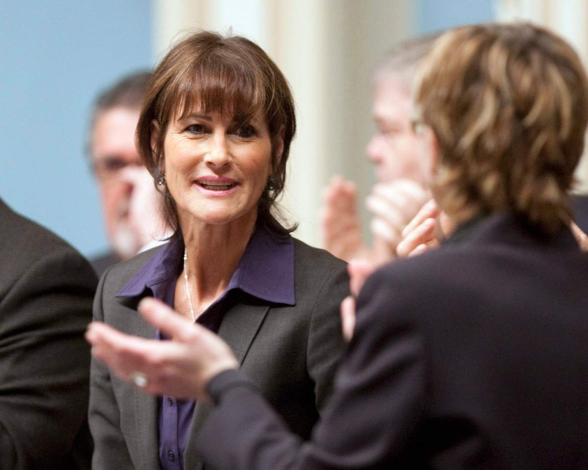 Kathleen Weil, Liberal MNA for Notre-Dame-de-Grâce, is applauded by legislature members after she tabled legislation on Muslim face-coverings Wednesday March 24, 2010 at the Quebec Legislature. Muslim women will need to uncover their faces from now on if they want to deal with the Quebec government, according to landmark legislation tabled in the province.