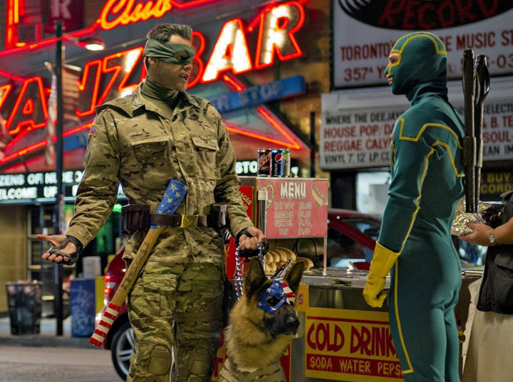 Jim Carrey and Aaron Taylor-Johnson on Toronto's Yonge Street in a scene from 'Kick-Ass 2.'.