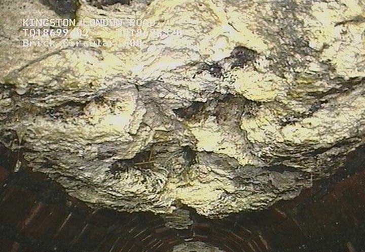 In this undated image released by Thames Water company, showing part of a 15-ton lump of fat and other debris coagulated inside a main London city sewer, which they have spent many days clearing from the drain, it is announced Tuesday Aug, 6, 2013.  
