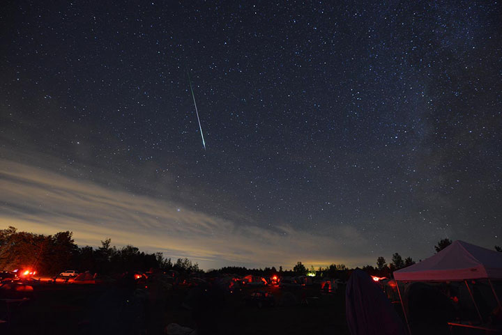 A beautiful meteor, part of the Perseid meteor shower, over the Starfest star party at River Place Park northwest of Mount Forest, Ont.
