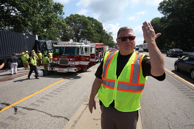 Kalamazoo County Kalamazoo County Sheriff Richard Fuller directs traffic in the eastbound lanes of I-94 to keep moving as emergency responders work to remove the bus driver from a Greyhound bus that collided with a semi-truck, Thursday, Aug. 1, 2013 on westbound Interstate 94 near Galesburg, Mich. Authorities say a Chicago-bound Greyhound bus hit the back of a semi-truck in southwestern Michigan, leaving 11 people with what were described as minor injuries.