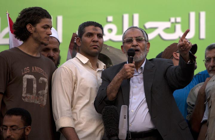 Mohammed Badie (R), supreme guide of Egypt's Muslim Brotherhood, addresses supporters in Cairo on July 5, 2013. 