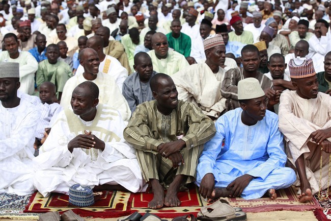 In this photo taken Thursday, Aug. 8, 2013, Nigeria Muslims attend Eid al-Fitr prayers in Maiduguri, Nigeria. 