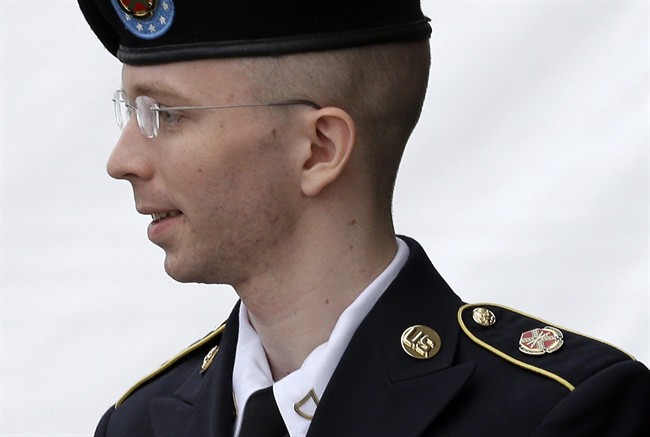 In this July 30, 2013 file photo, Army Pfc. Bradley Manning is escorted out of a courthouse in Fort Meade, Md. after receiving a verdict in his court martial.