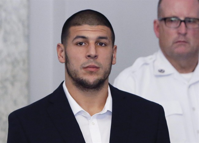 FILE - In this Wednesday, July 24, 2013 file photo, former New England Patriots NFL football tight end Aaron Hernandez appears during a probable cause hearing at Attleboro District Court, in Attleboro, Mass. 