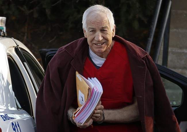 n this Jan. 10, 2013, file photo, former Penn State assistant football coach Jerry Sandusky arrives at the Centre County Courthouse for a post-sentencing hearing in Bellefonte, Pa. 