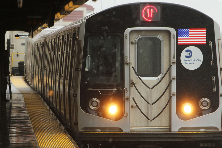 A New York City Subway train pulls up to a station on February 23, 2010 in New York City.