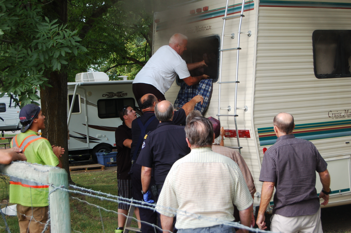 Oliver Fire Chief Dan Skaros saves young boy from fiery RV .