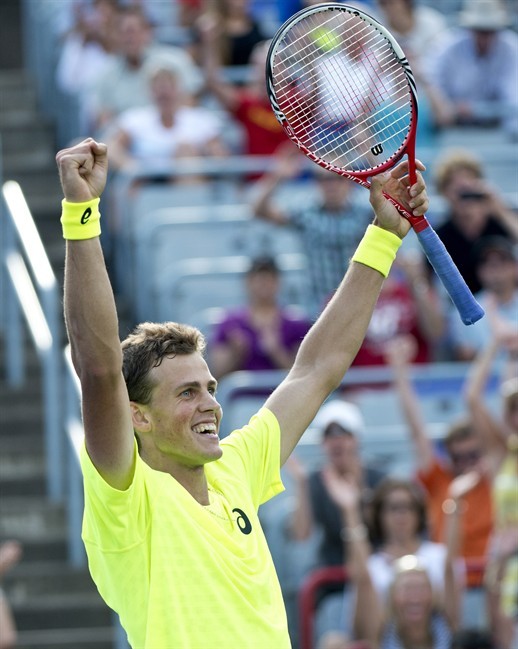 Canada's Vasek Pospisil celebrates his victory over John Isner of the United States during first round of play at the Rogers Cup tennis tournament Tuesday August 6, 2013 in Montreal.